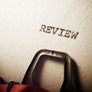 Typerwriter with the word Review on the paper