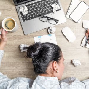 exhausted worker sleeping at desk