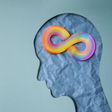 Image of a human head with a rainbow neurodiversity figure eight on it. 